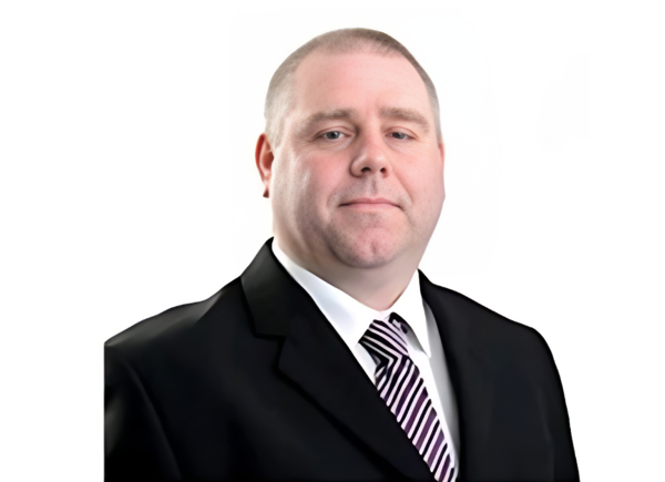 Headshot of a man in a suit